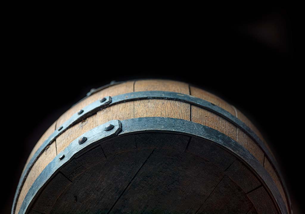 wooden barrel with a black background
